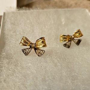 Sterling Silver and 14kt gold vintage bow earrings.